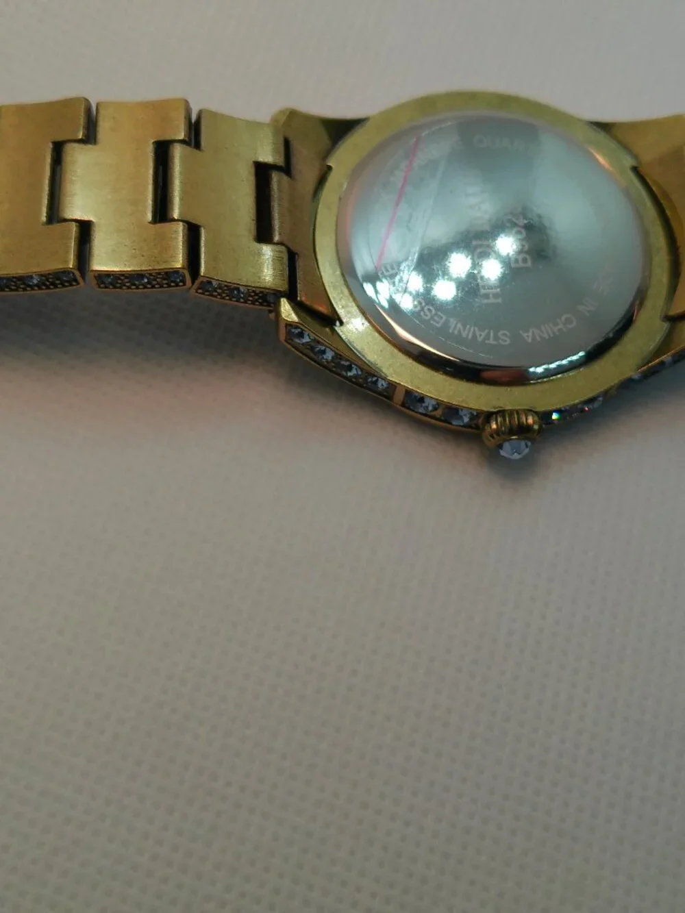 Heidi Daus quartz fashion watch bronze-tone covered with lavender-purple crystal